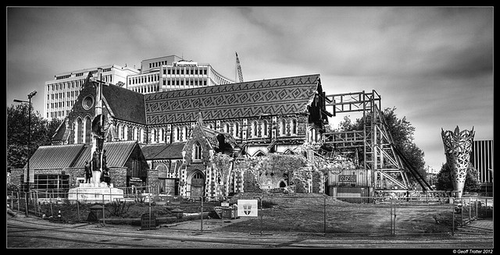 Black and White photograph of the Christ Church Cathedral with a partially collapsed roof and scaffolding.