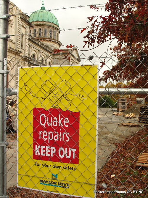 Basilica, sign in foreground, Quake repairs keep out